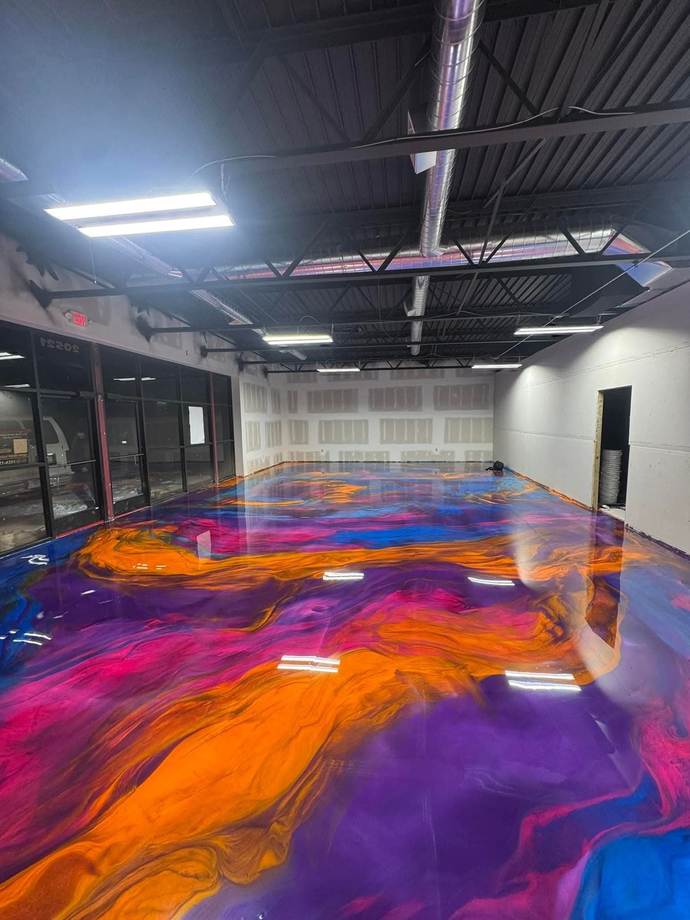 Colorful metallic epoxy floor by Resinate Coatings, Cedar Rapids